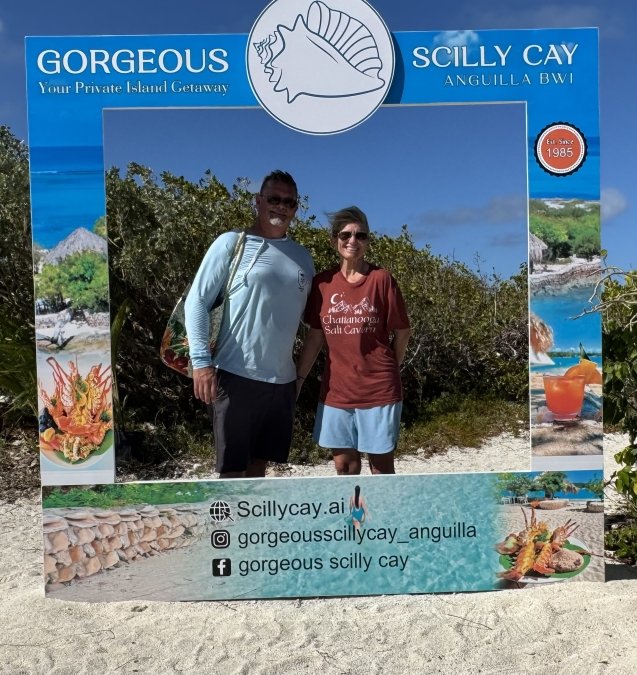 W4IO & XYL at the Scilly Cay Photo Sign